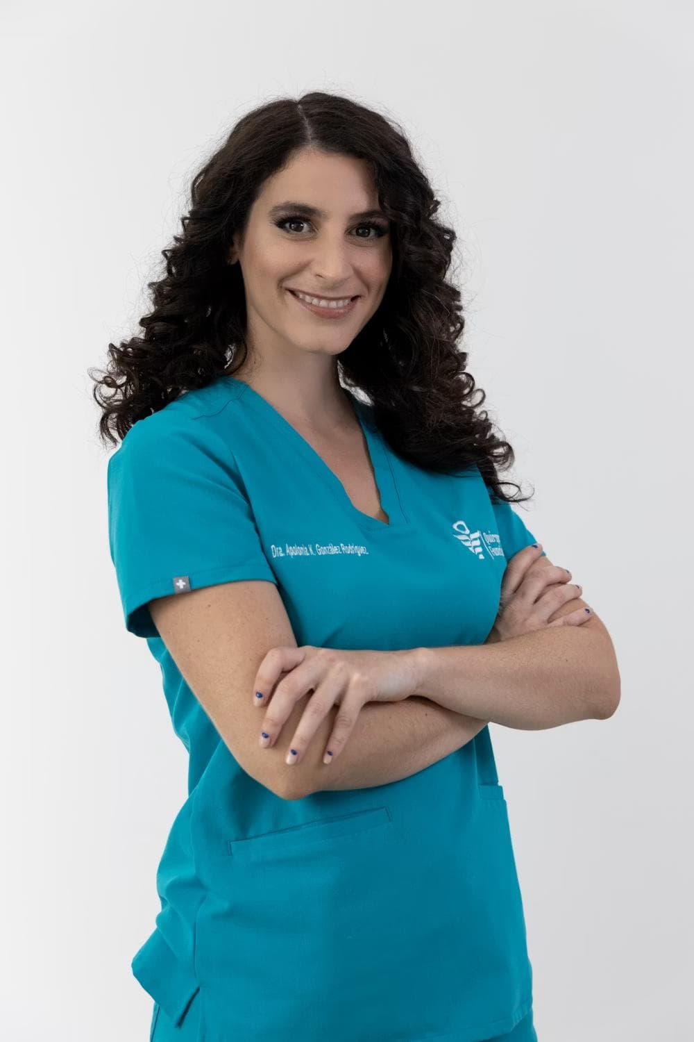 A genetic counsellor in teal scrubs