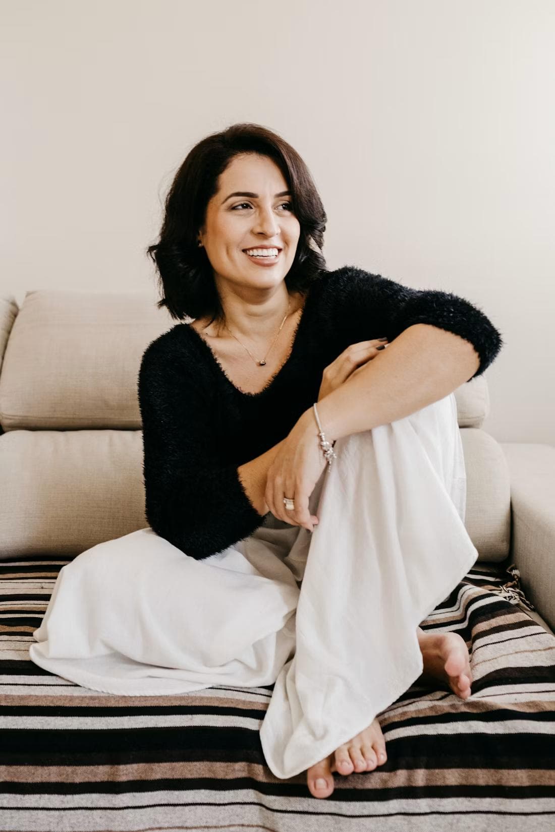A young woman sitting calmly at home